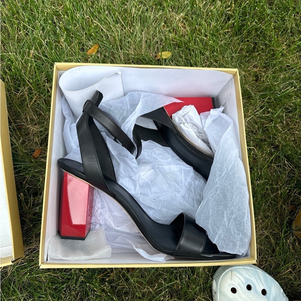 Size 11 black with red heel 
Never worn